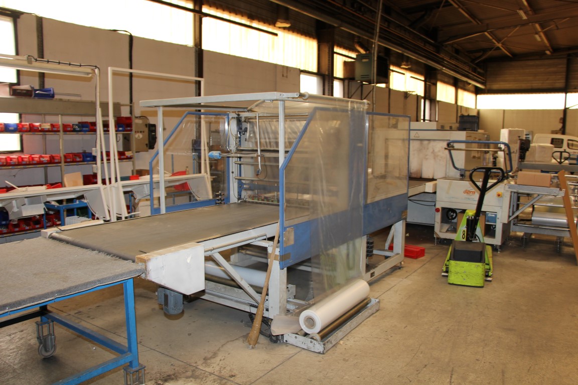 Film wrapping line with oven